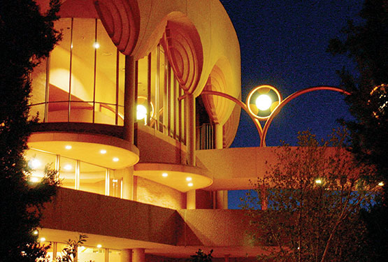 Frank Lloyd Wright's architecture for ASU Gammage Auditorium is seen at its best when illuminated for an evening performance.