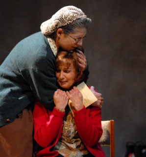 Cathy (right) is a mom being consoled by her adoptive other (Maria Amorocho) in Arizona Jewish Theatre's multigenerational drama, Kindertransport, produced in 2008. (Photo credit unknown)