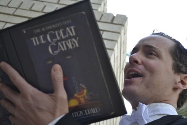 Ian Christiansen reads "The Great Gatsby" aloud at Tempe Marketplace. (Photo courtesy of Arizona Theatre Company)