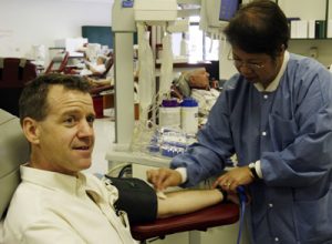 Honestly, we're not trying to make a subtle statement here, but it is so hard to find pictures of actor/playwright Michael Grady on the web that, for the moment, we had to make do with this shot of him donating during a blood drive.