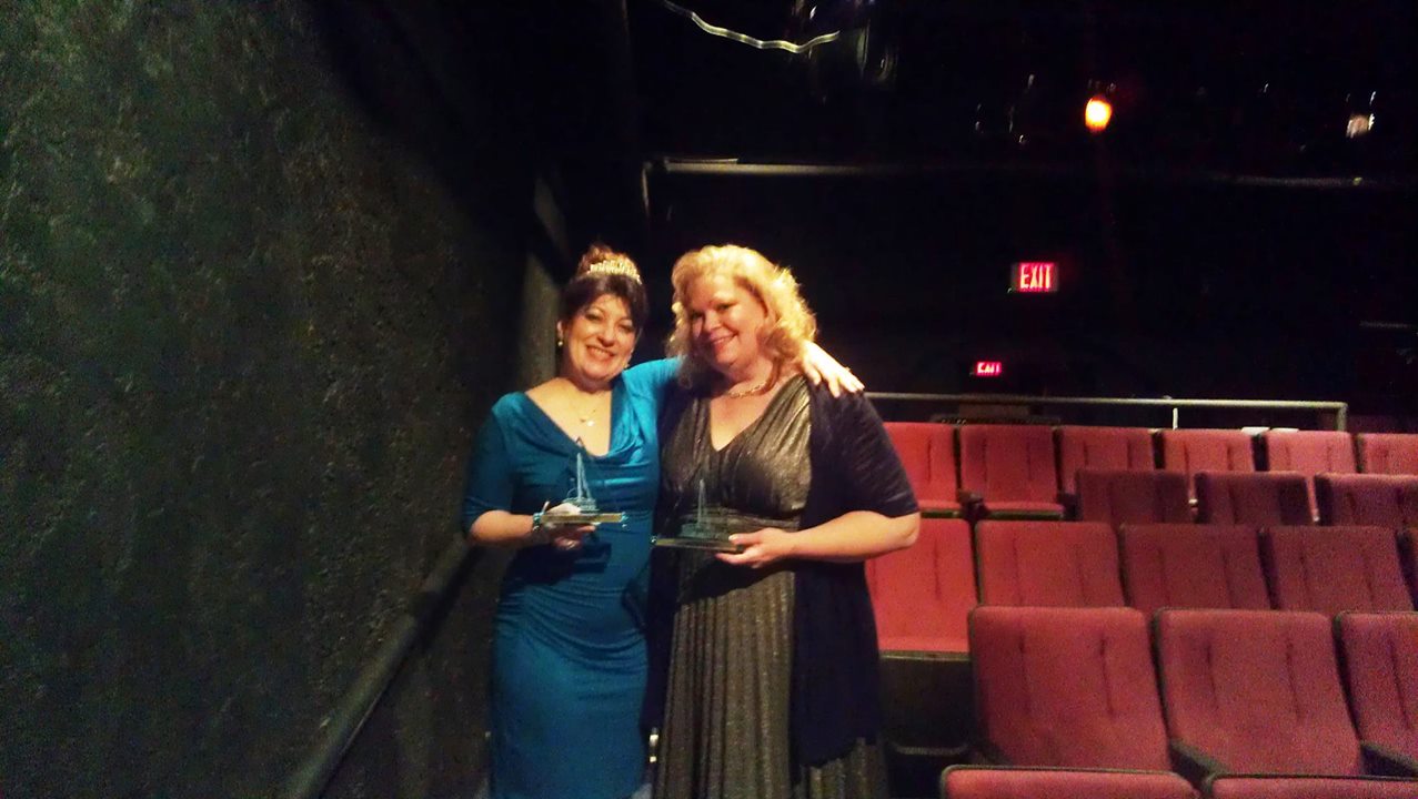 Lizz Reeves Fidler and Tanya Schoenwolf show off their 20014 Prizm Awards from Fountain Hills Theatre. (Photo credit unknown)